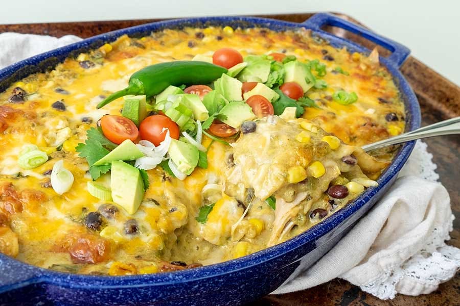 enchilada Mexican casserole made with chicken leftovers and black beans in a baking dish