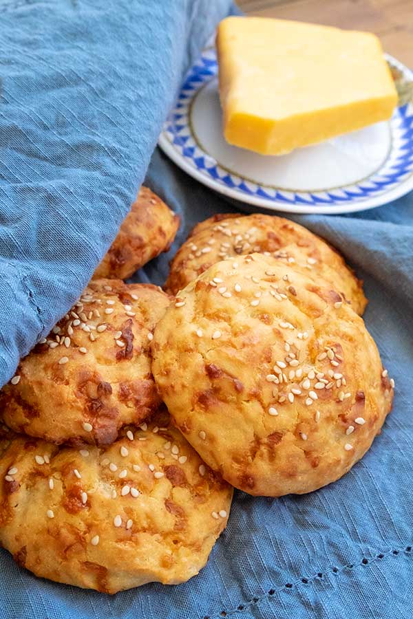 gluten free cheese buns with a side plate of butter