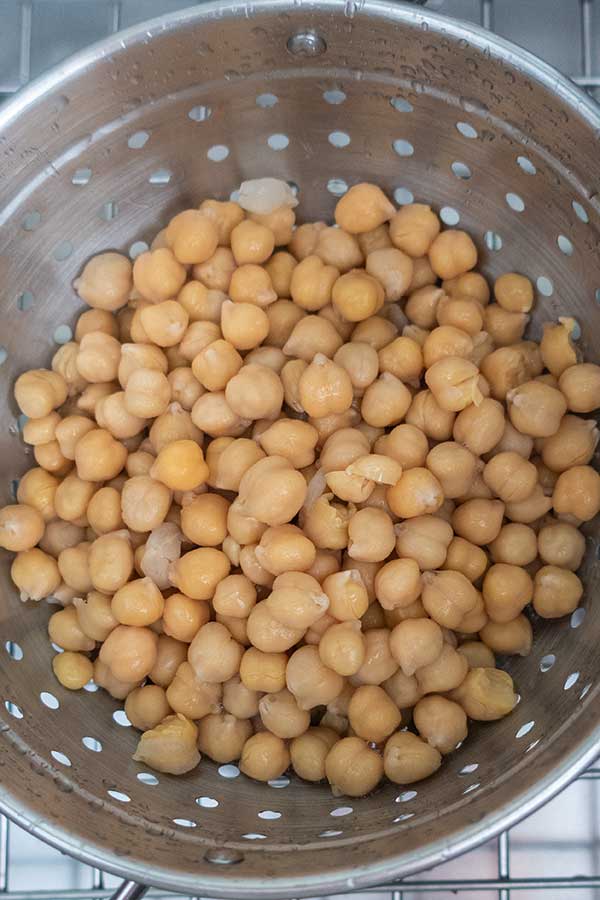 cooked chickpeas in a strainer