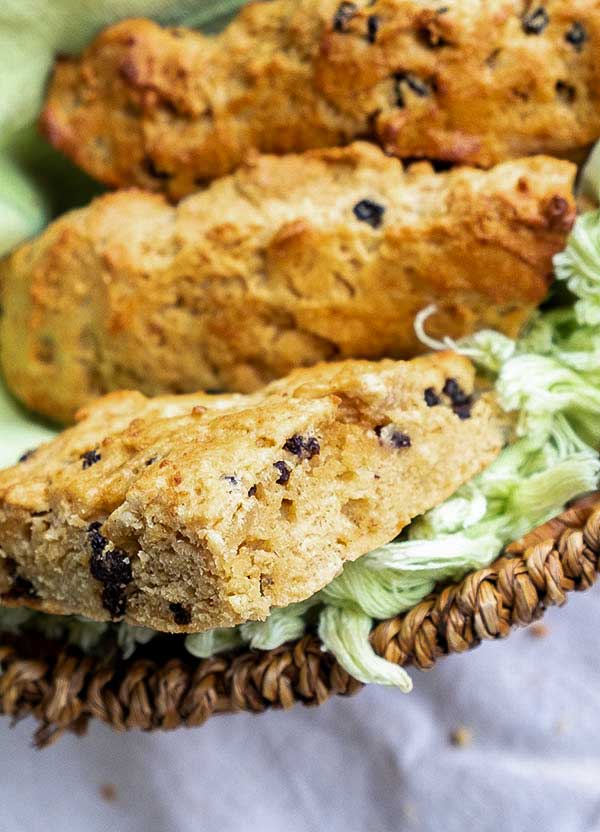 three gluten-free scones with currants in a basket