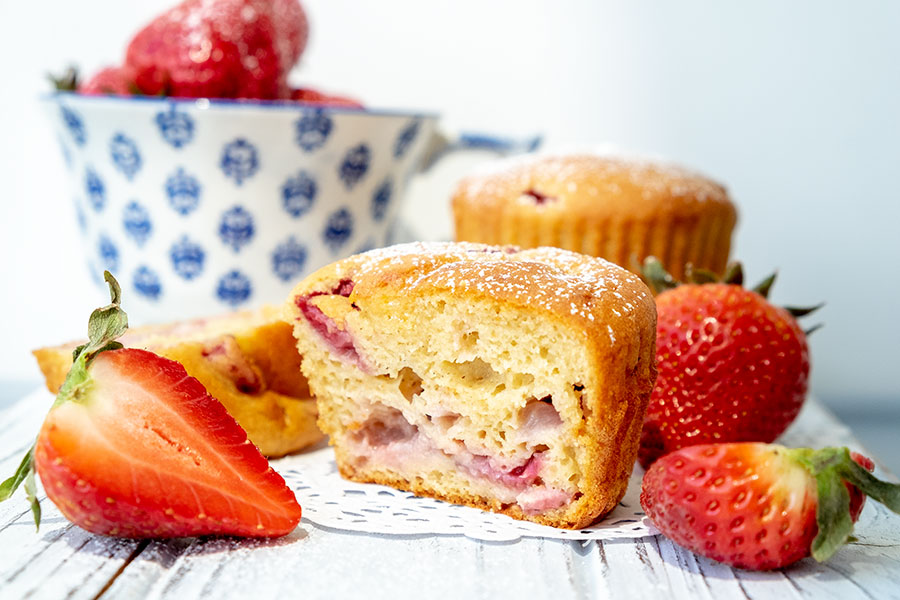 close up of muffins with strawberries