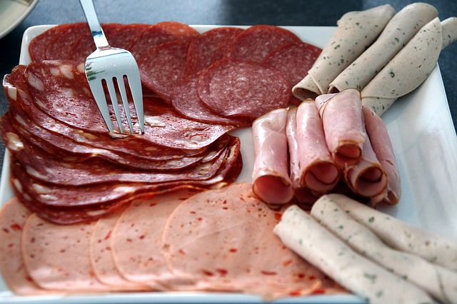 slices of various processed meats on a plate