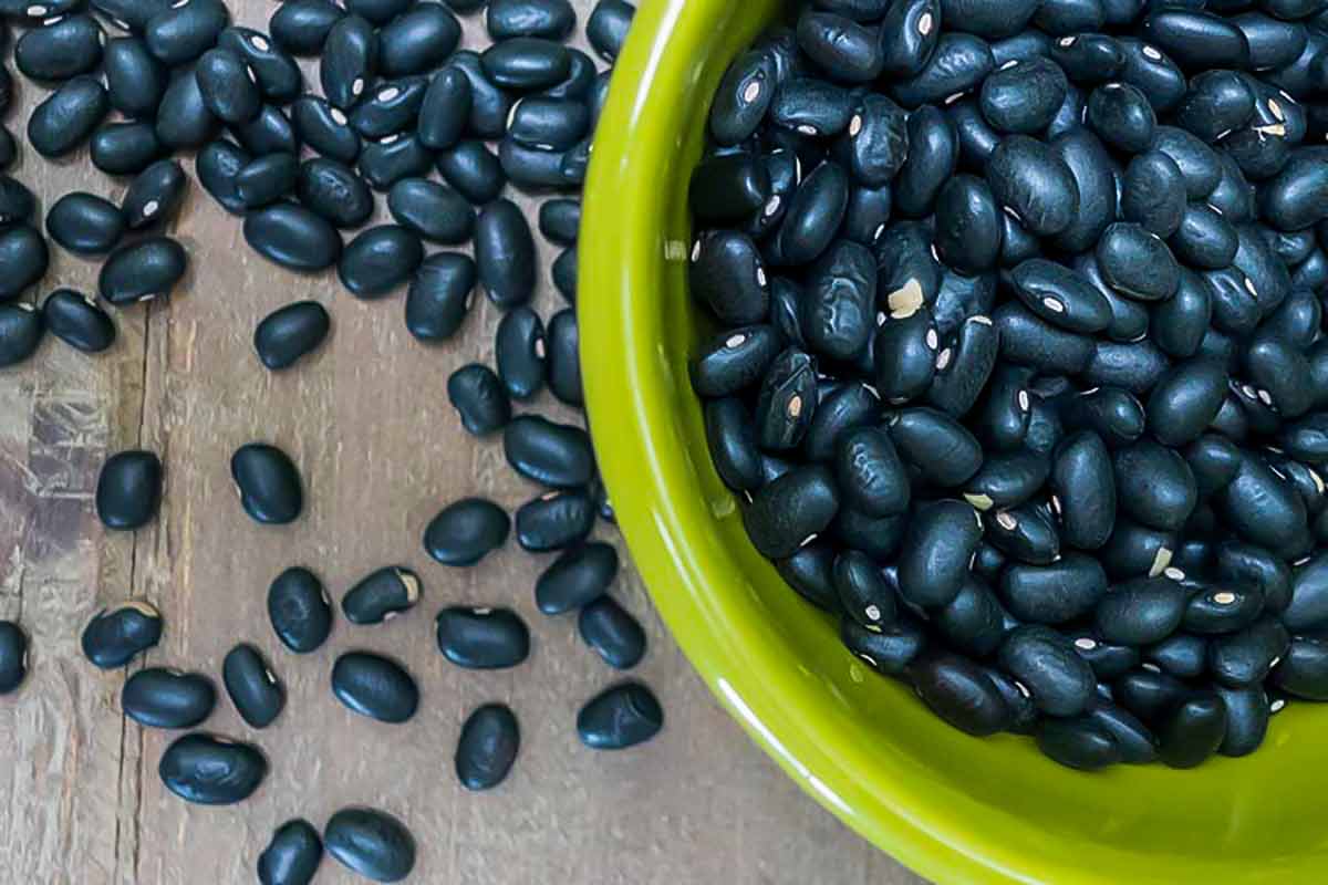 uncooked black beans in a bowl