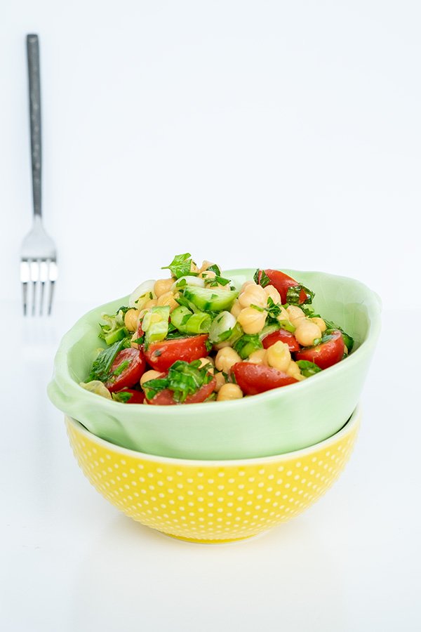 chickpea salad with tomatoes and cucumber in a bowl