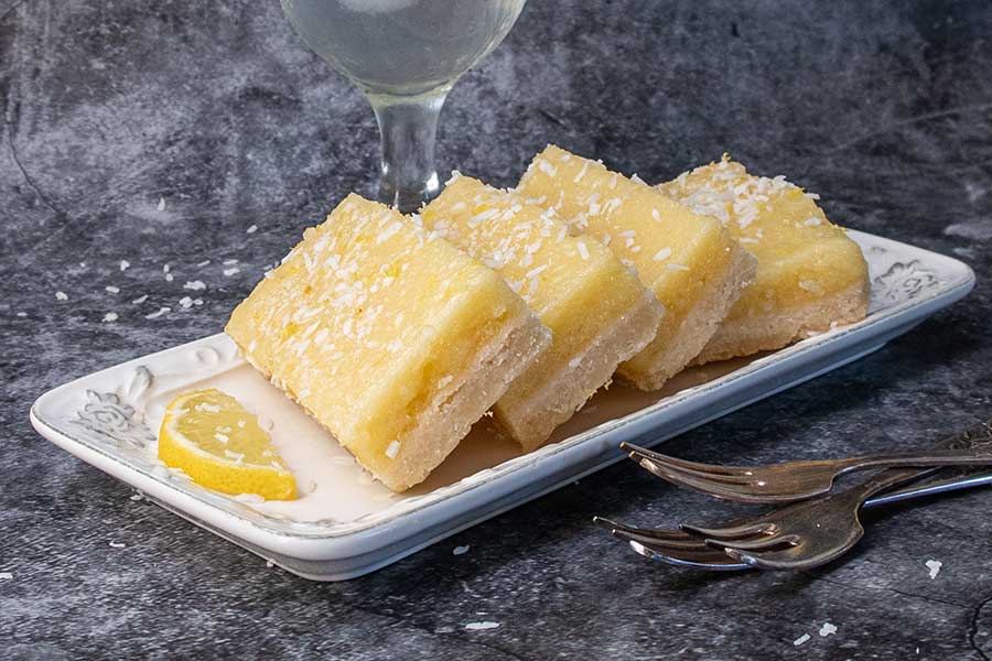 slices of lemon coconut bars on a plate, dairy free dessert