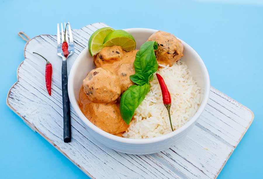 vegan thai meatballs in a bowl with rice