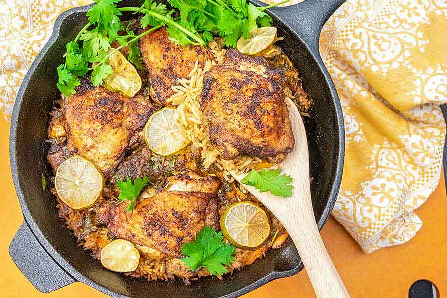 chili lime chicken with rice in a cast iron skillet
