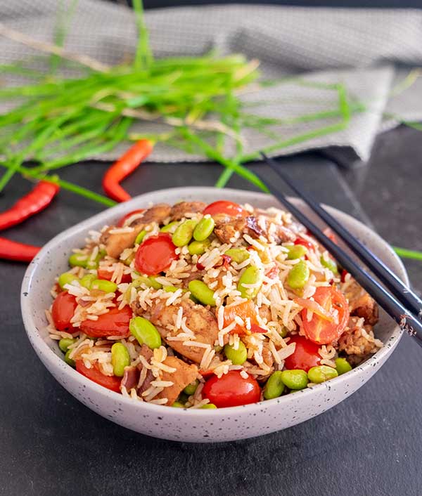 Louisiana chicken, rice and edamame in a bowl.