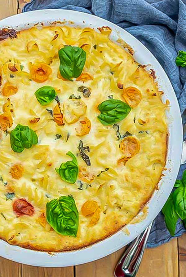 top view of gluten free Caprese Mac And Cheese in a pie dish