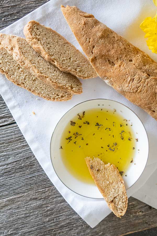 gluten-free ciabatta with a bowl of olive oil for dipping