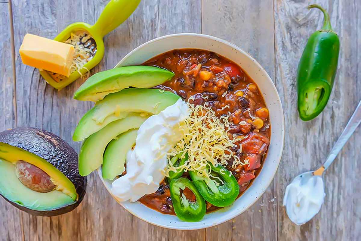 overview of Cincinnati black bean chilli with toppings in a bowl