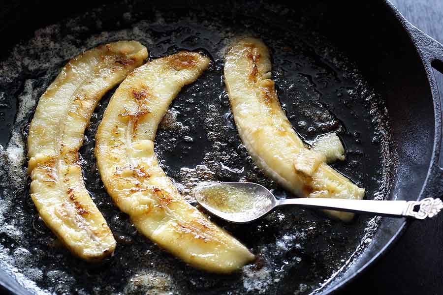 BANANAS COOKING IN CAST IRON SKILLEET