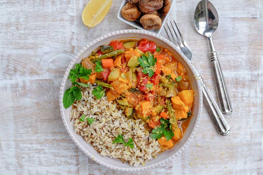 moroccan vegetable stew with rice in a bowl