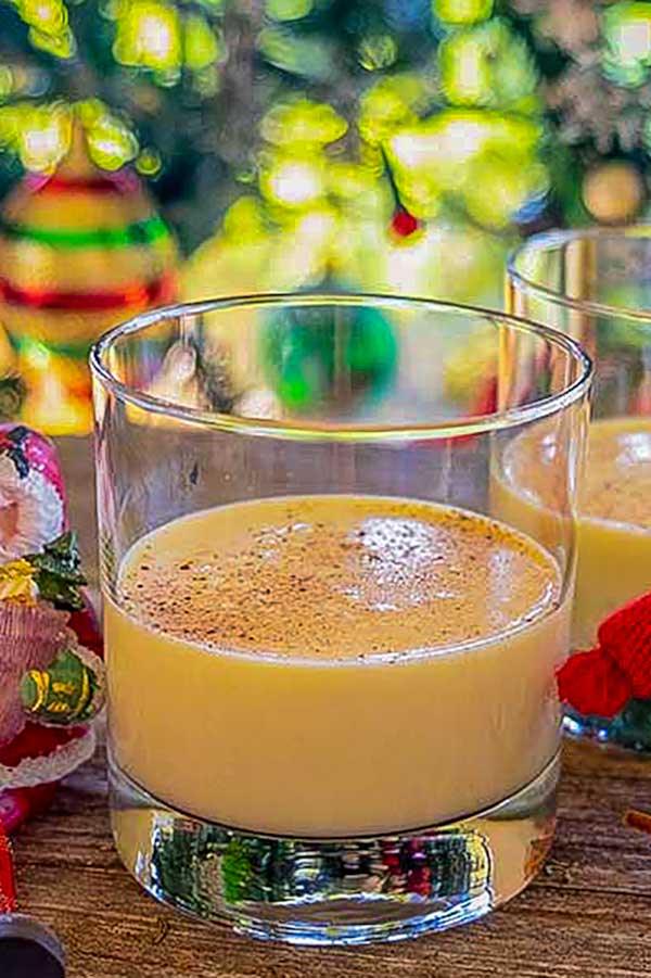 vegan eggnog in a glass with christmas decor