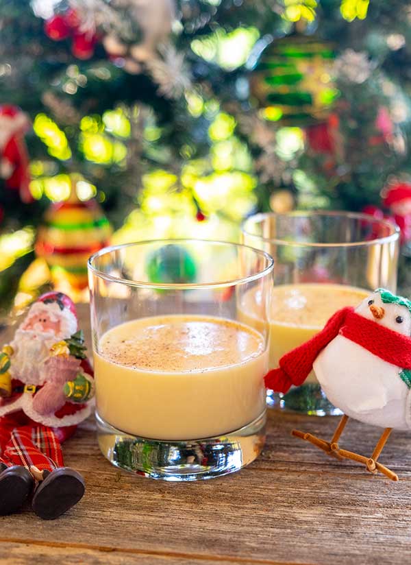 eggnog in a glass with christmas decor