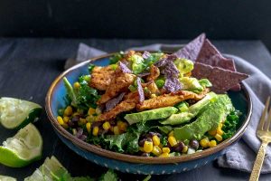 baja chicken kale salad with limes on the side