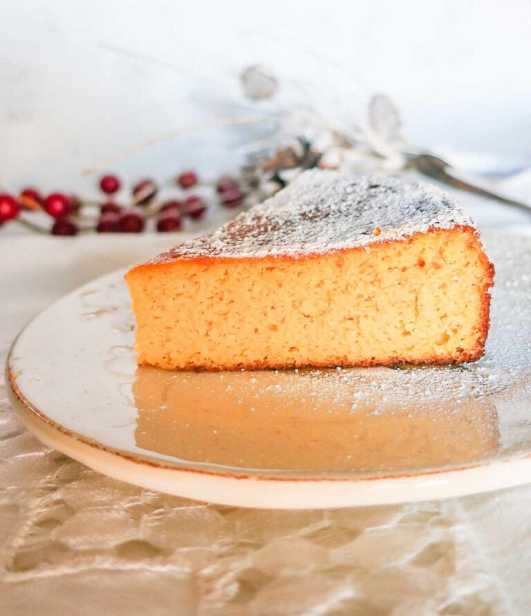 a slice of grain free mandarin cake on a plate