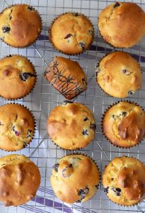 olive oil blueberry walnut muffins on a cooling rack