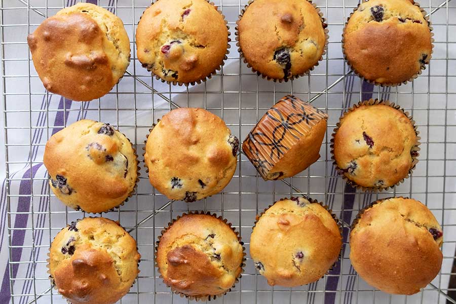 olive oil blueberry walnut muffins on a cooling rack, gluten free