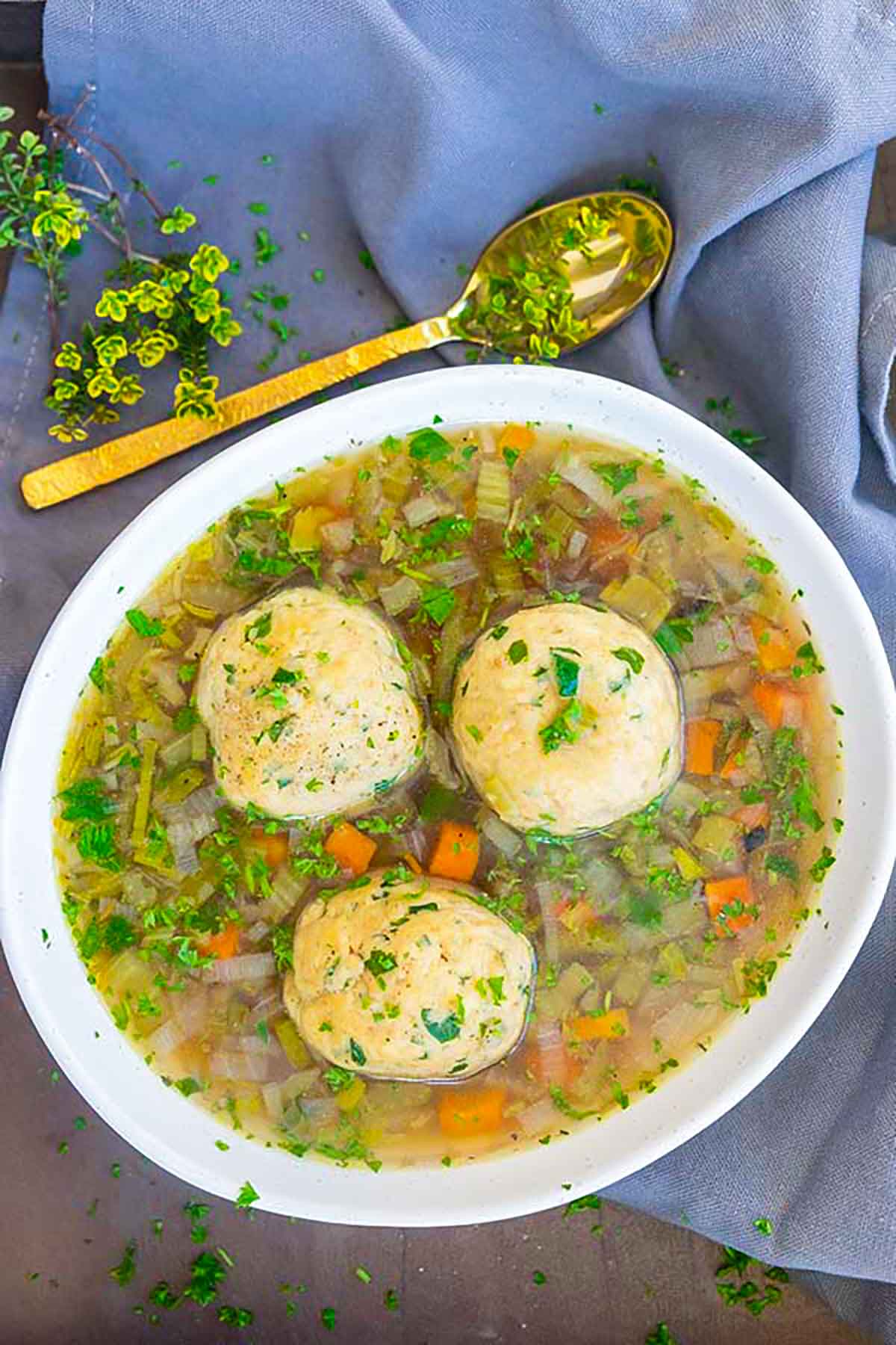 three matzo balls in chicken soup