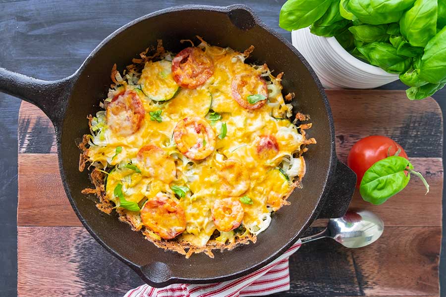 zucchini leeks bacon gratin in a cast iron skillet, low carb