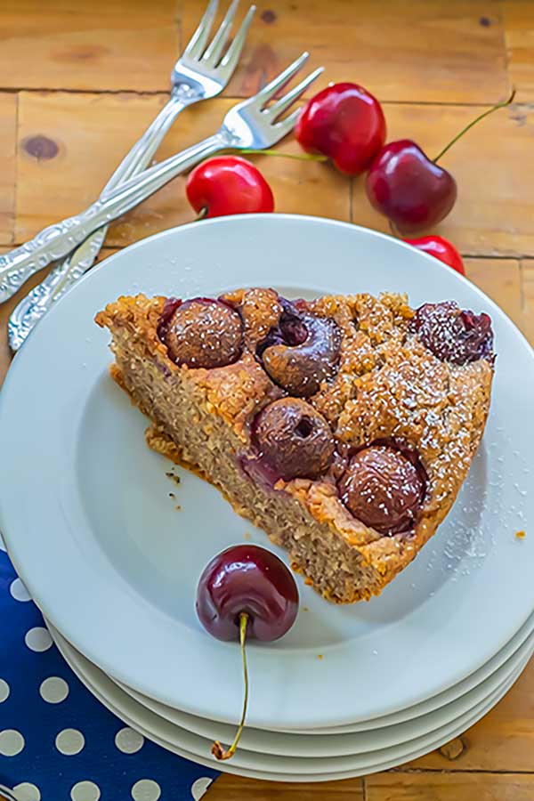 slice of cherry breakfast bread on a plate