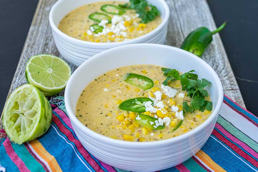 Mexican street corn soup with toppings in bowls