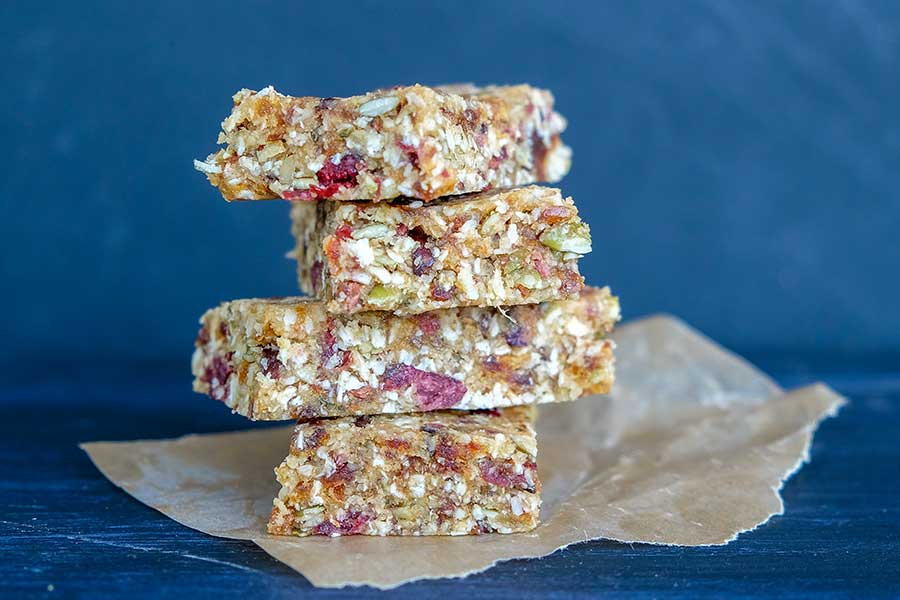 stacked pumpkin seed cranberry bars