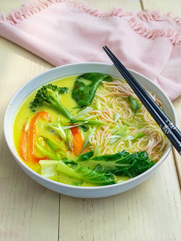 takeout-style coconut curry ramen in a bowl with chopsticks