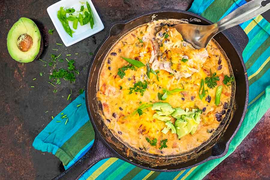 overview of cheesy spaghetti squash casserole in a skillet