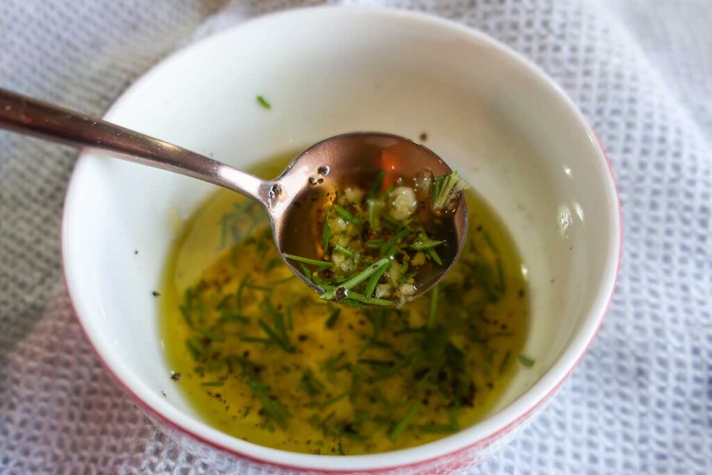 rosemary and garlic infused olive oil in a bowl