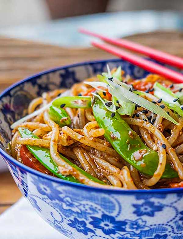 chinese noodles in a bowl with chopsticks