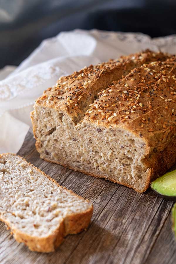 sliced gluten free flax bread on a cutting board