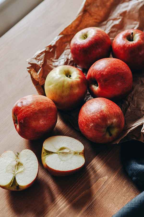 scattered apples on a cutting board