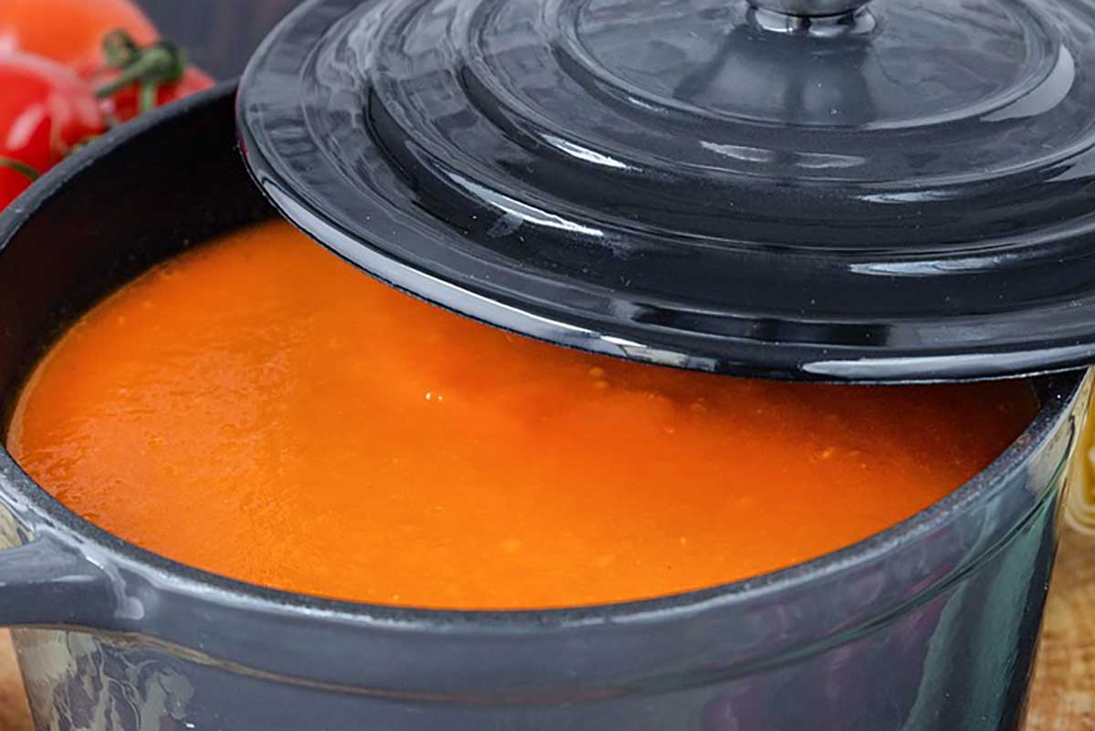 red enchilada sauce in a saucepan