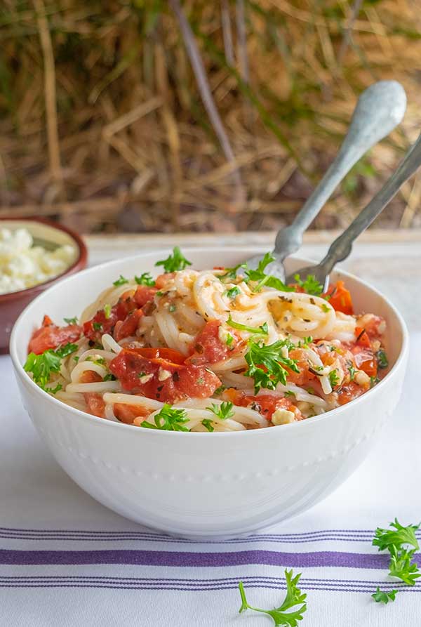 tomato feta gluten-free pasta in a bowl