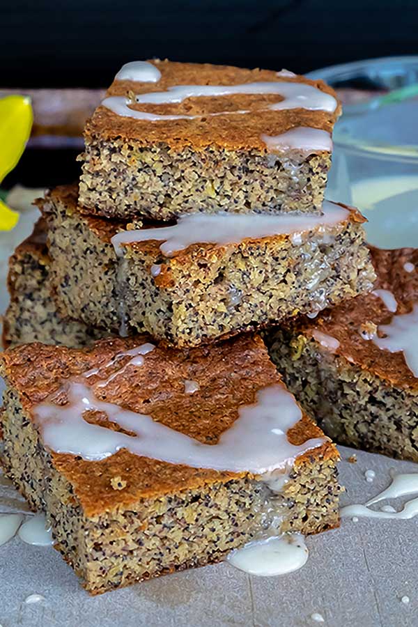 stacked slices of grain free poppy seed cake