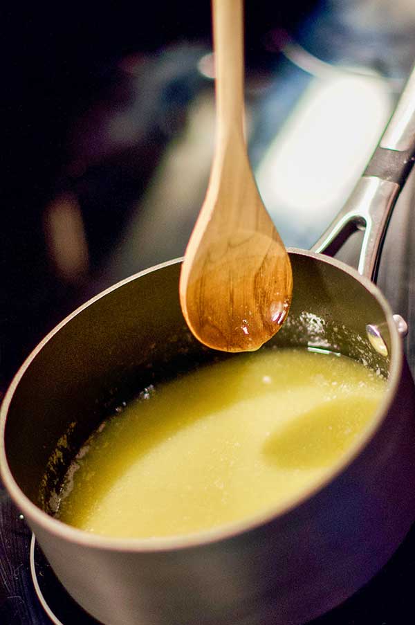 melted butter in a saucepan with wooden spoon