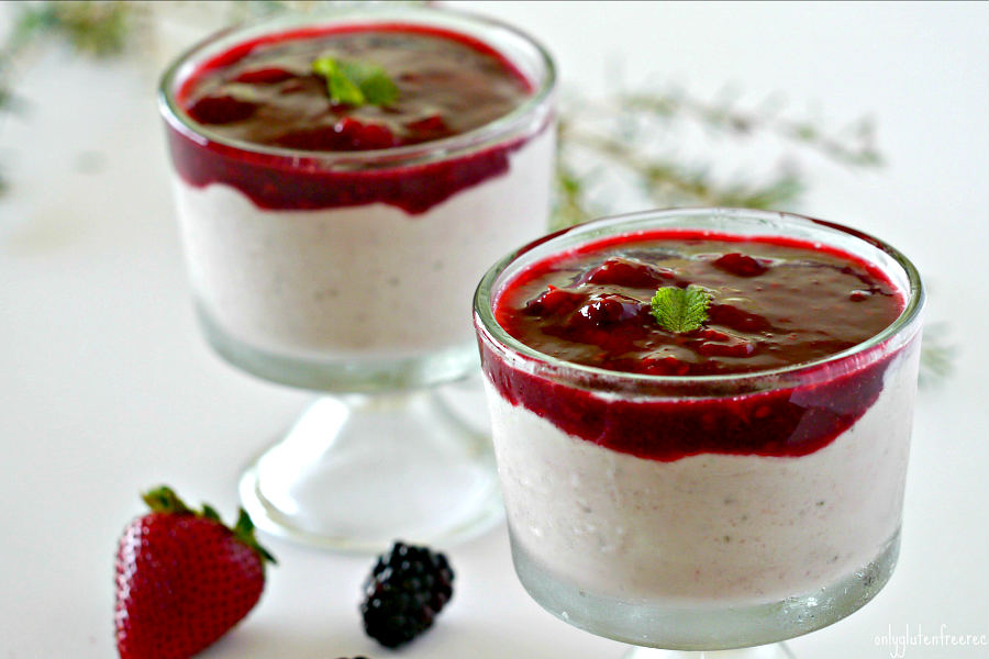 strawberry ricotta mousse topped with blackberry sauce in a glass 