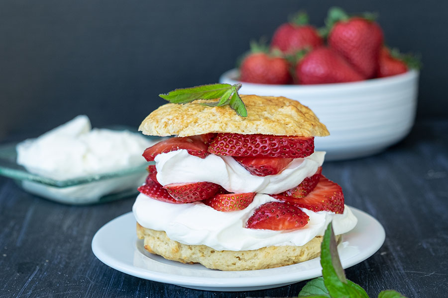 strawberry shortcake on a plate garnished with mint, gluten free