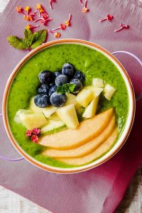 overview of pineapple smoothie bowl topped with fruit