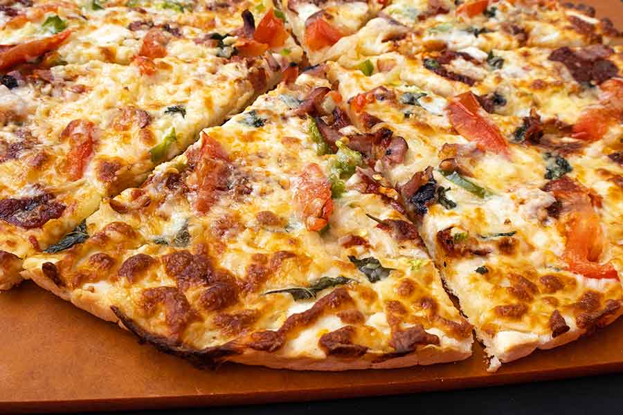 gluten-free, yeast-free thin crust pizza sliced