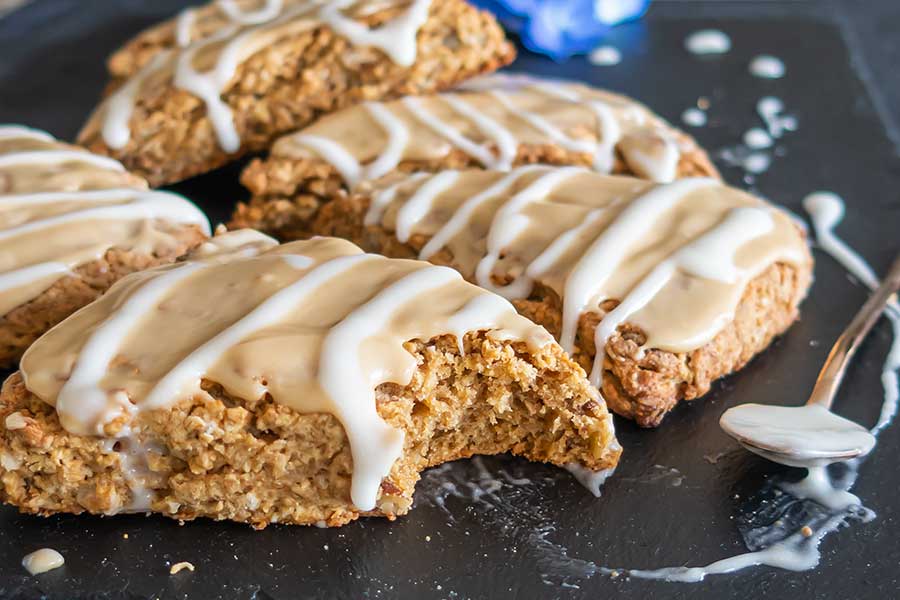 glazed gluten free maple oat nut scones on a plate