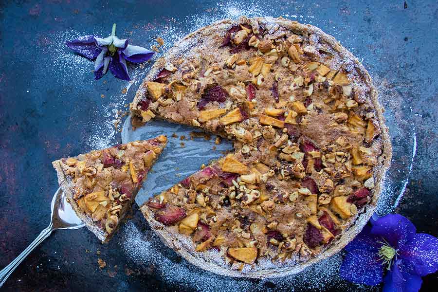 overview of whole gluten free strawberry apple cake on a platter