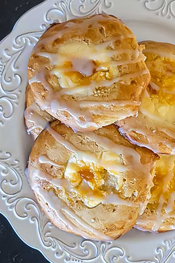 3 stacked gluten-free cheese danishes on a plate