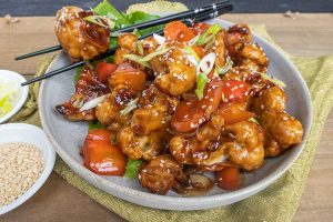 Gluten free Vegetarian Kung Pao Cauliflower with sauce on a plate