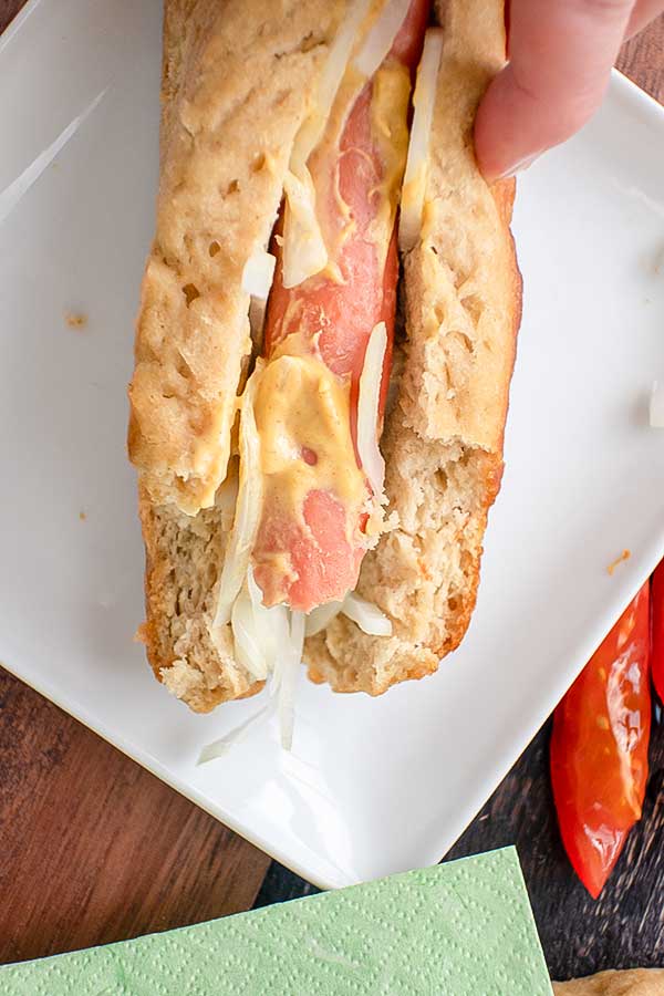 wiener inside a gluten-free hot dog bun 