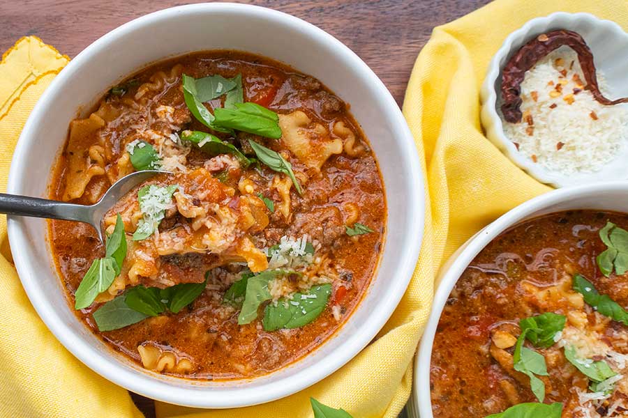 Italian lasagna soup topped with basil