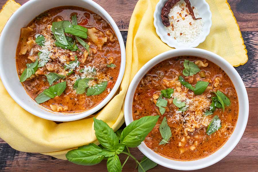 overhead image of lasagna soup in two bowls