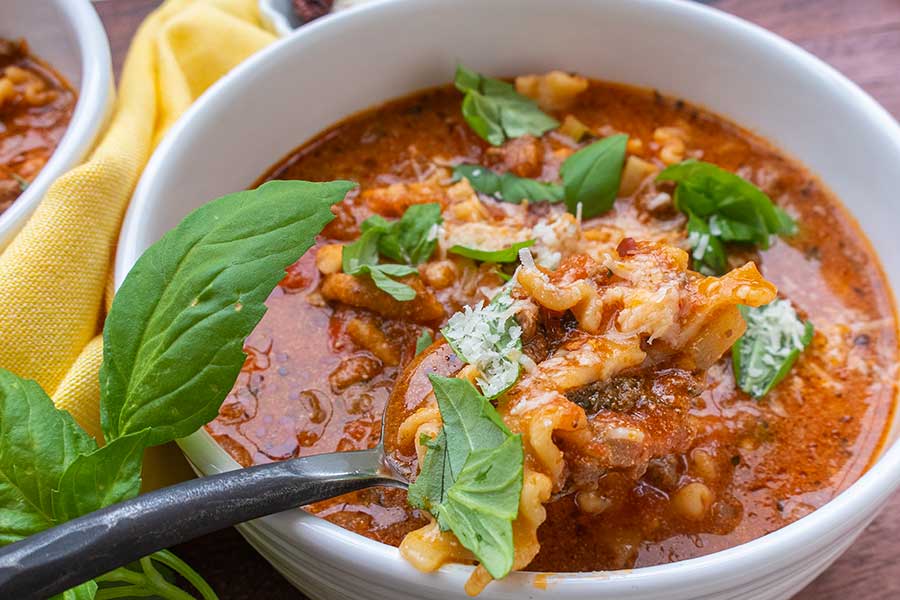 close up of lasagna soup in a bowl